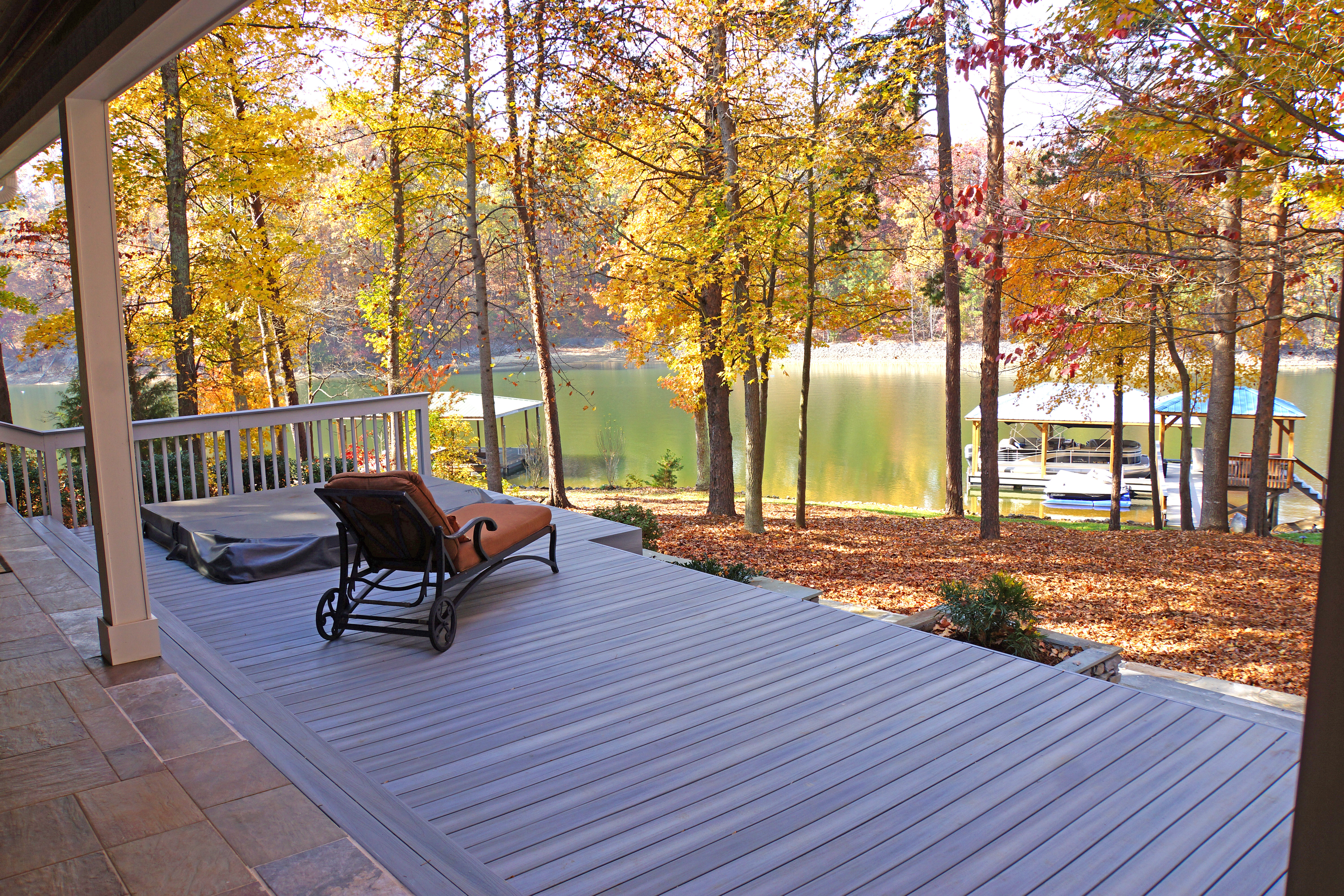 Composite deck and hot tub by Distinctive Design + Build + Remodel on the shores of Lake Norman.