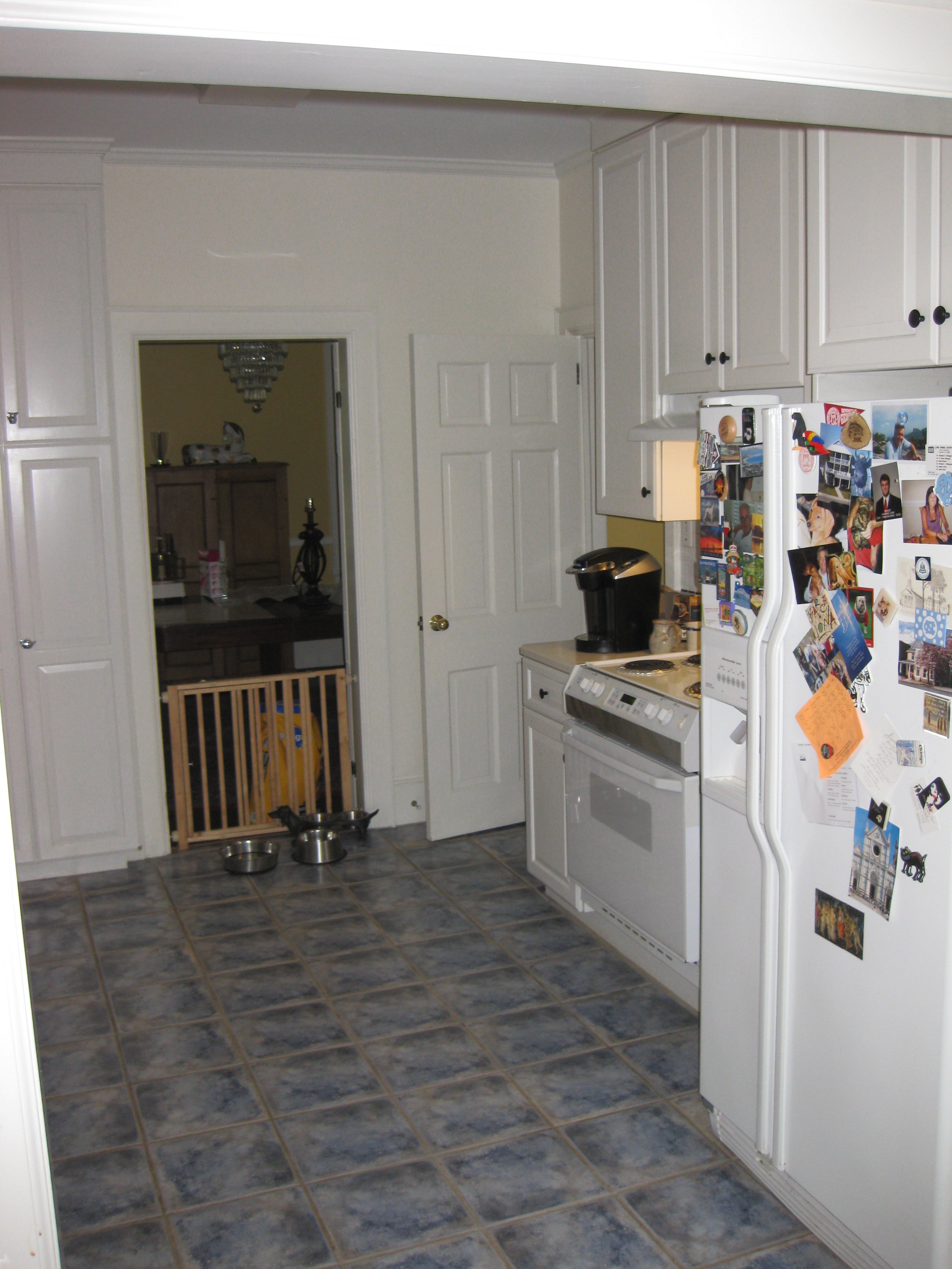 A kitchen with blotchy blue time before a down-to-the-studs remodel by Distinctive Design + Build + Remodel in the Myers Park neighborhood of Charlotte, NC.