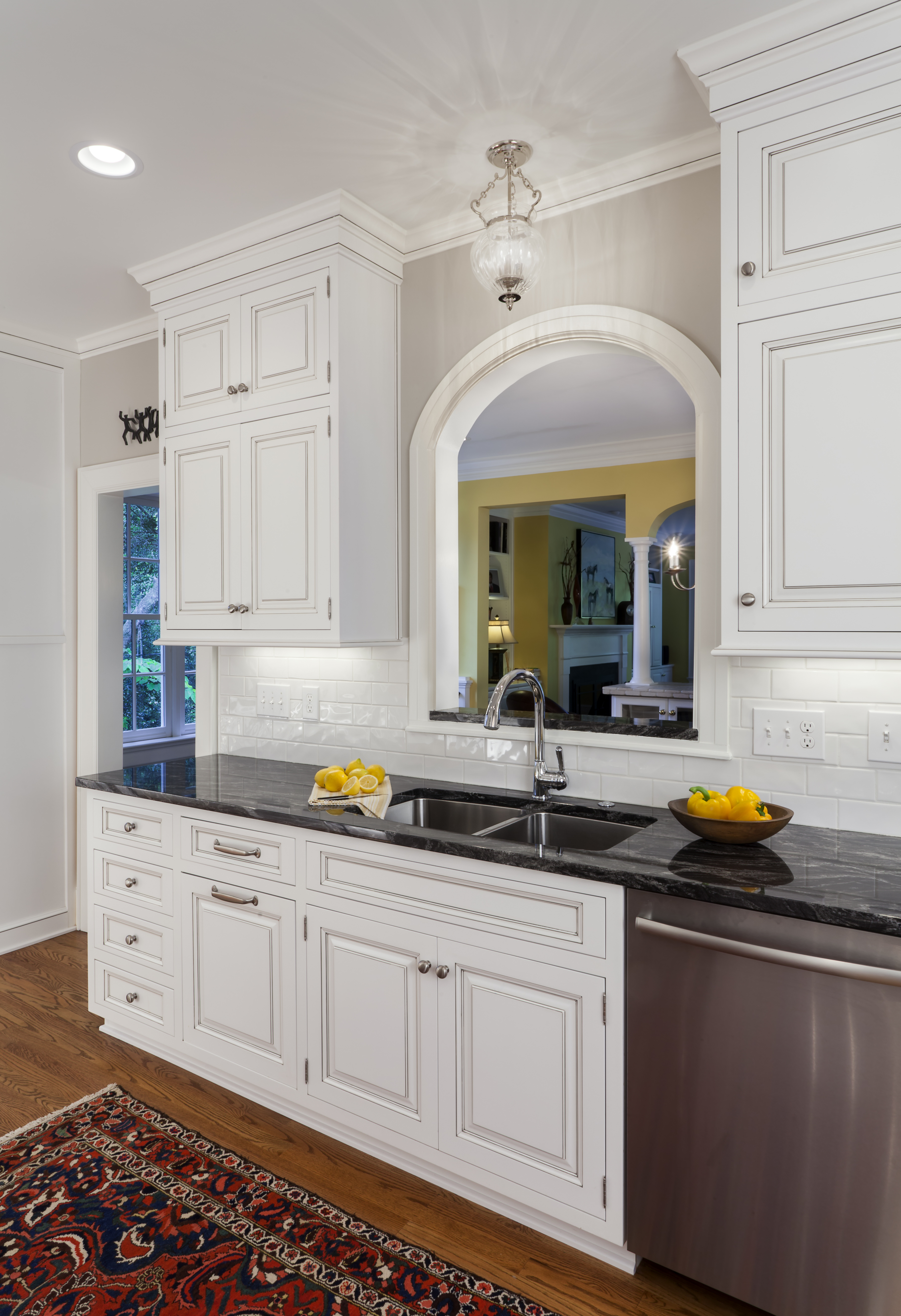 Double-bowl undermount stainless-steel sink in a kitchen remodel by Distinctive Design + Build + Remodel in the Myers Park neighborhood in Charlotte, NC.