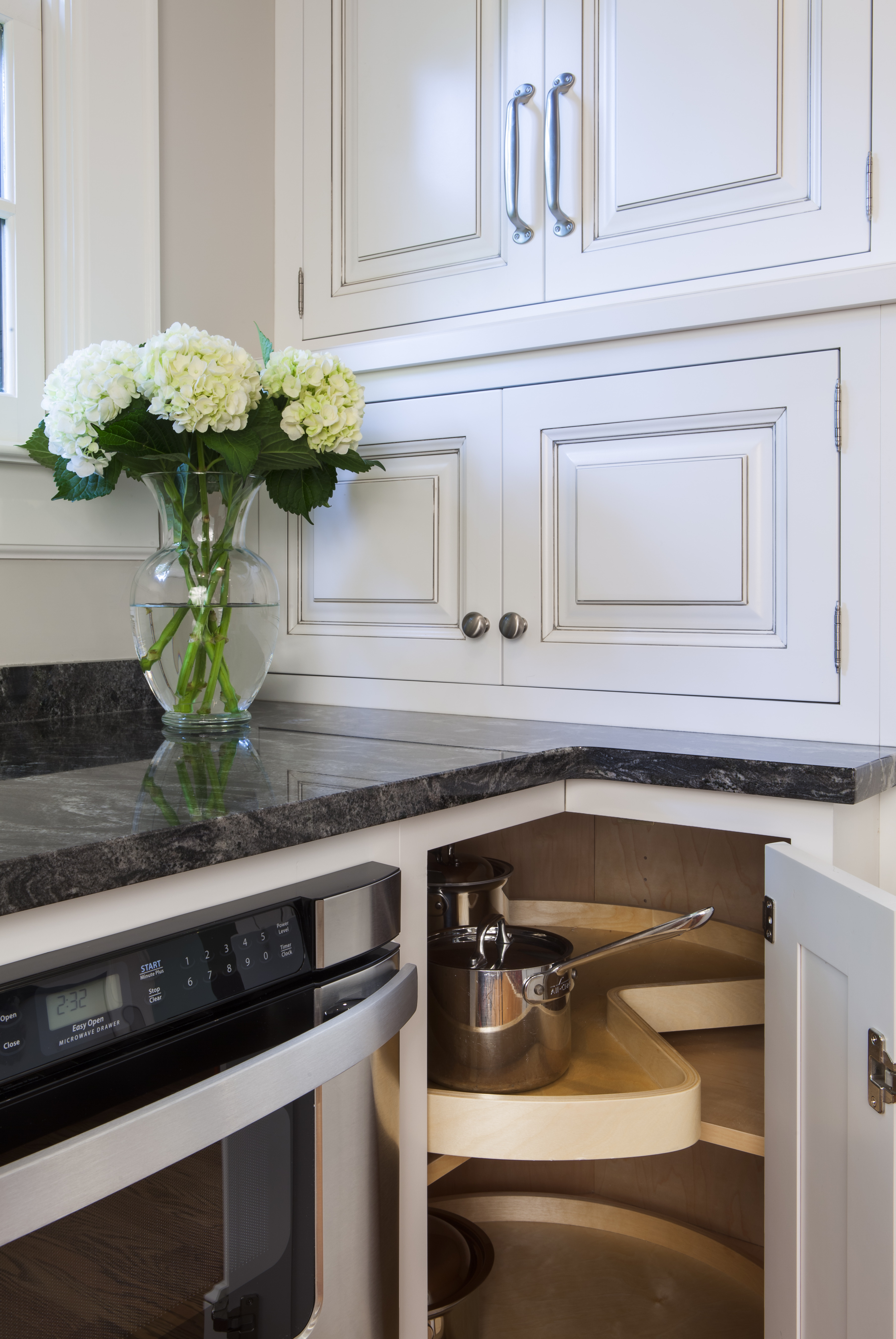 Wood Lazy Susan with inset cabinet doors in a kitchen remodel in a historic home in Myers Park by Distinctive Design + Build + Remodel.