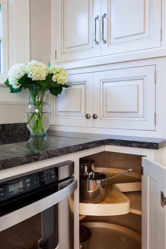 Wood Lazy Susan with inset cabinet doors in a kitchen remodel in a historic home in Myers Park by Distinctive Design + Build + Remodel.