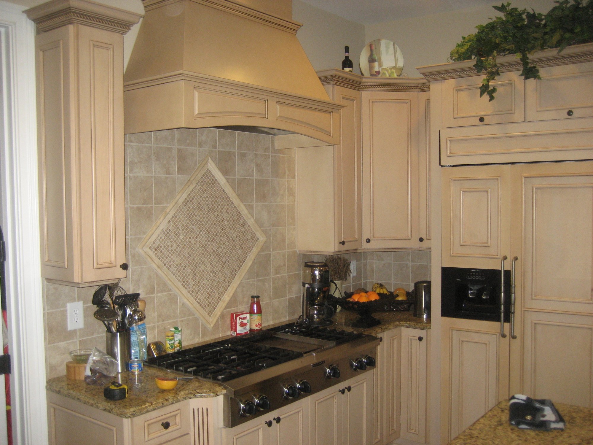 A cooktop in a kitchen on Lake Norman before transformative remodel by Distinctive Design + Build + Remodel.