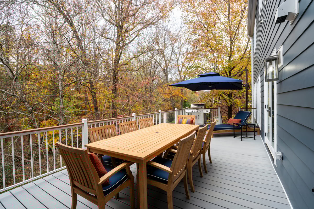 Trex deck and composite handrail in Charlotte, NC by Distinctive Design + Build + Remodel.