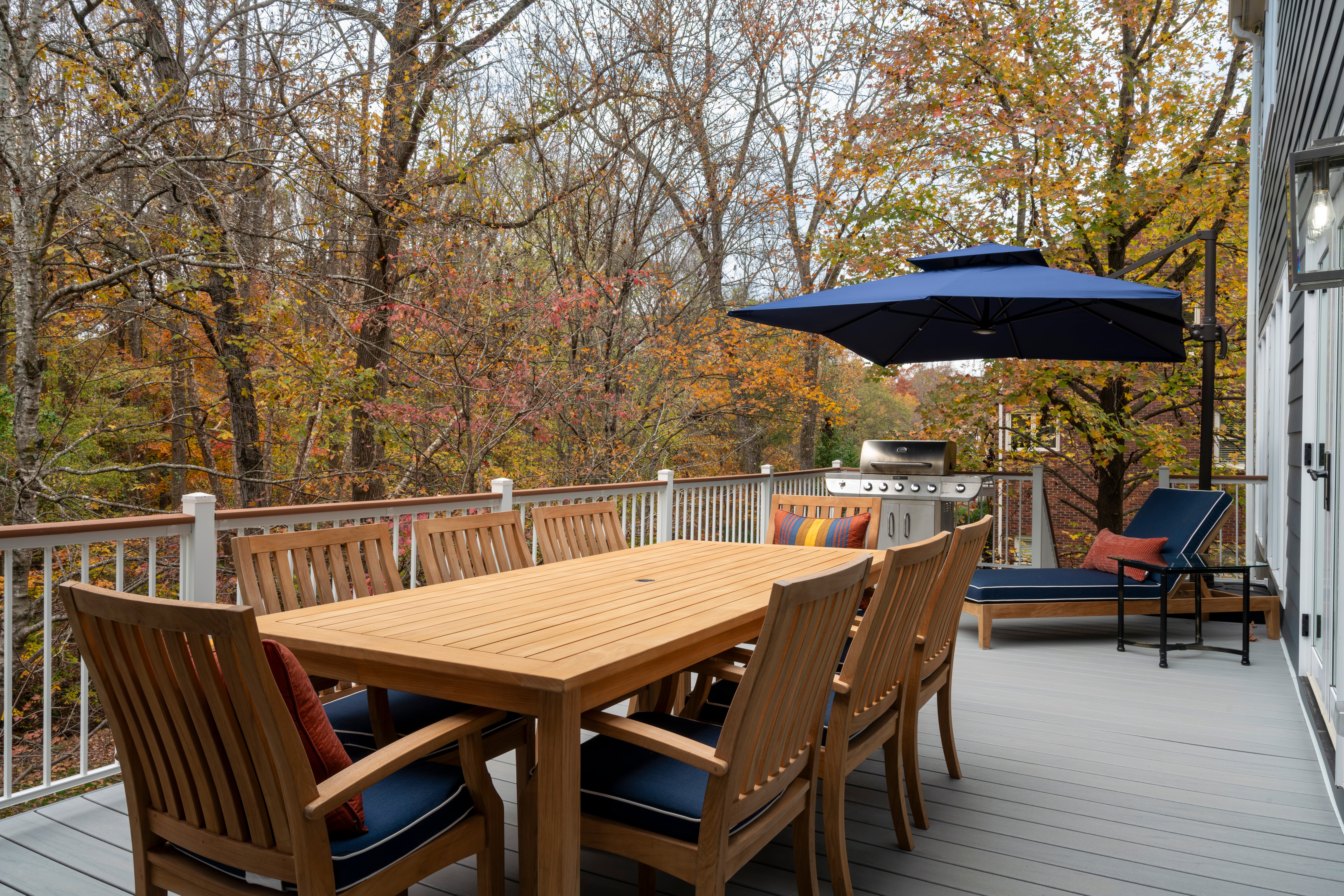 Trex deck with composite railing and drink rail in Charlotte, NC by Distinctive Design + Build + Remodel.