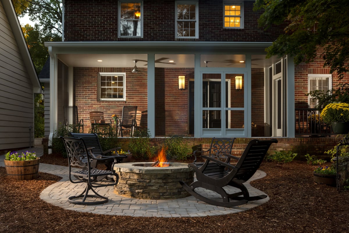 New screened porch and fire pit in the Myers Park neighborhood in Charlotte, NC by Distinctive Design + Build + Remodel.