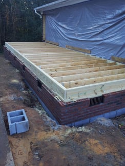 Framing and foundation for a home addition in Charlotte, NC by Distinctive Design + Build + Remodel.