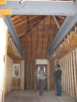 General Contractor, Vince Busby, consulting with framer during extensive whole-house remodel by Distinctive Design + Build + Remodel on Lake Norman.