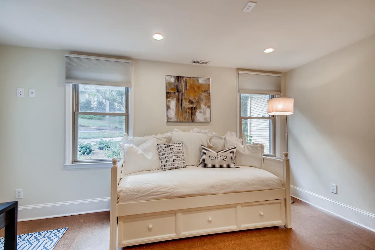 Garage converted to flexible space for a home office and guest bedroom in Charlotte, NC by Distinctive Design + Build + Remodel.