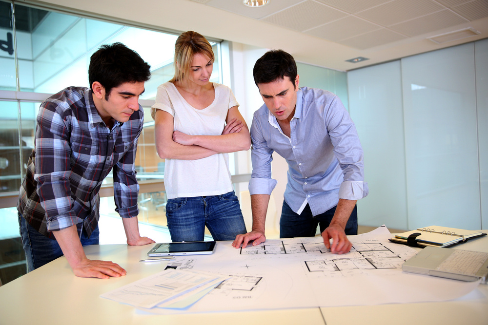 architect-team-working-construction-plans-01