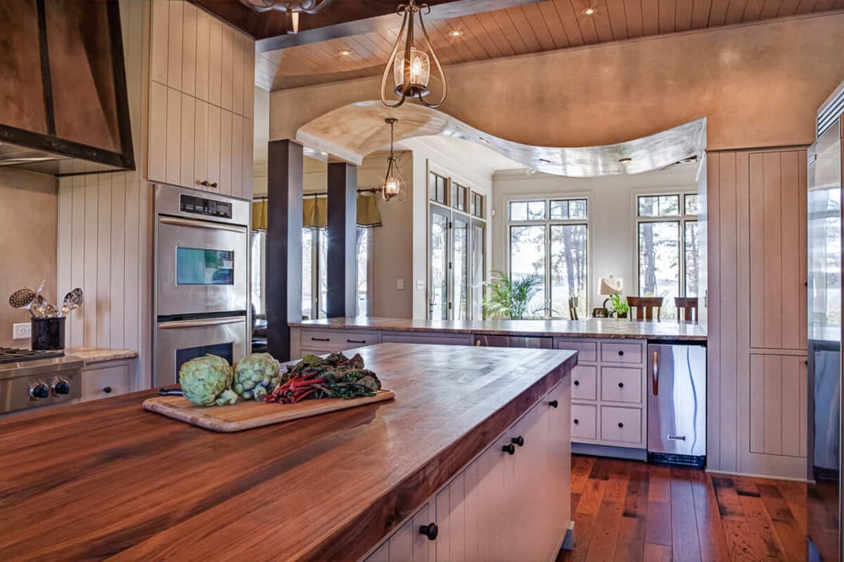 Luxury kitchen remodel in Davidson, NC with curved Venetian plaster ceiling by Distinctive Design + Build + Remodel.