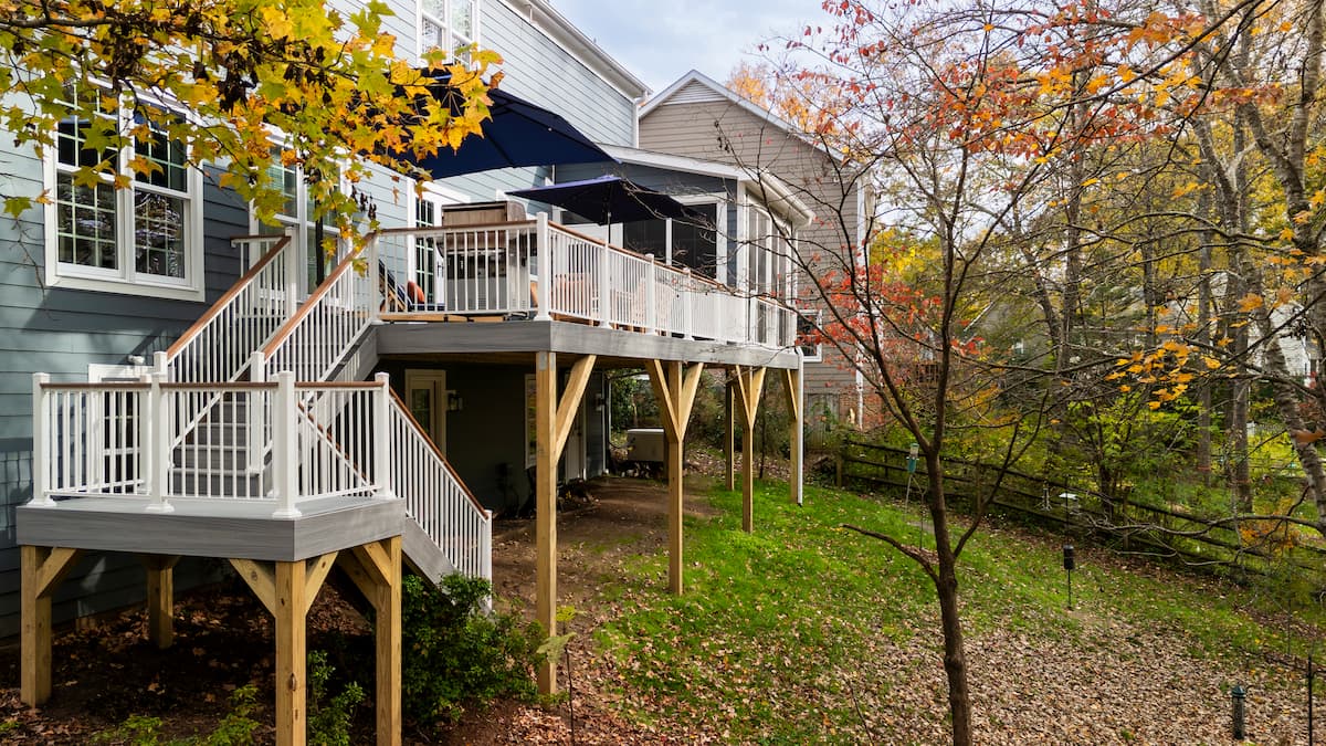 Relocated stairs on a Trex deck by Distinctive Design + Build + Remodel in Charlotte, NC.