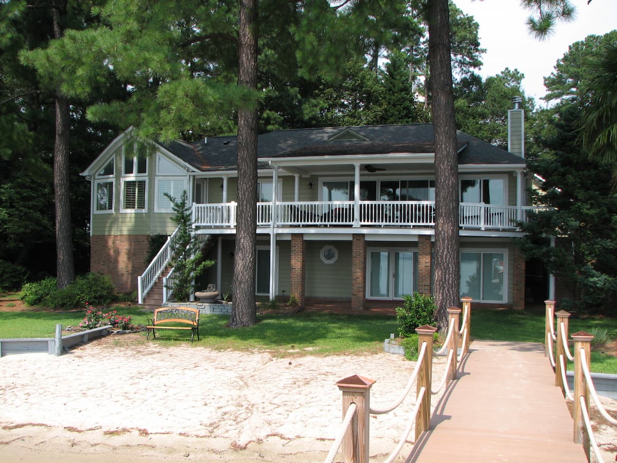 Whole house remodel on Lake Norman by Distinctive Design + Build + Remodel with layout changes, extensive structural engineering and all new fixtures and finishes.