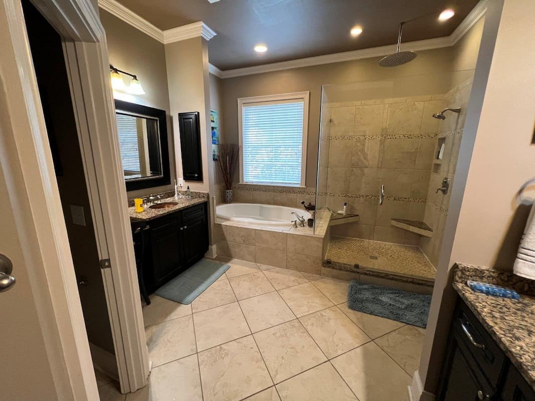 Ballantyne master bathroom before remodel by Distinctive Design + Build + Remodel.