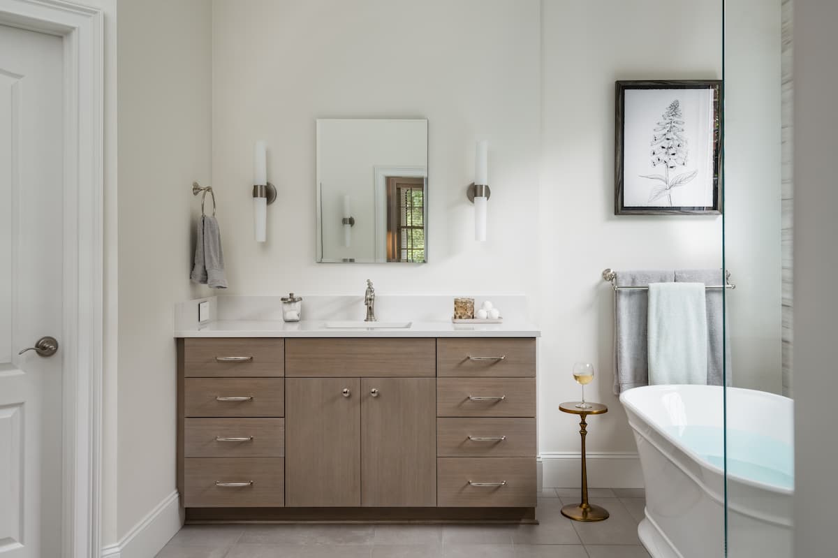 Large vanity with Robern mirrored medicine cabinet in master bathroom remodel by Distinctive Design + Build + Remodel in Charlotte, NC.