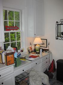 Before the remodel - a desk in the kitchen is unused and not practical.