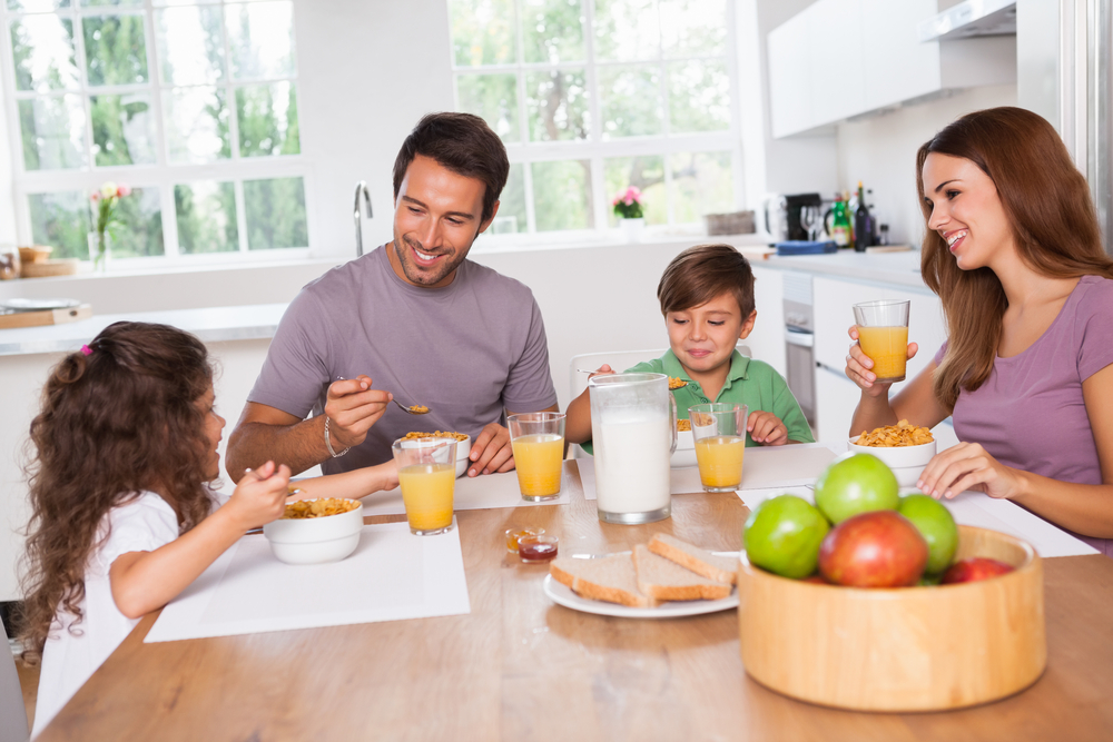 Family eating healthy breakfast in kitchen in Charlotte, NC